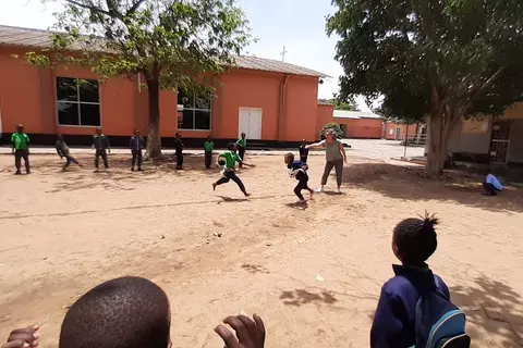 Montse is playing with the kids at St. Paul's School in the afternoon.