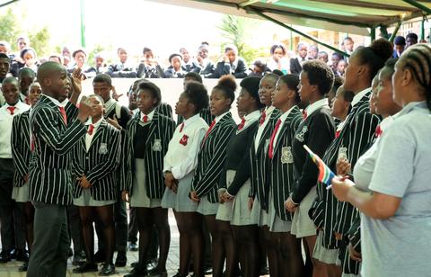 The chorus at Ekuphumleni High School singing for visitors 
