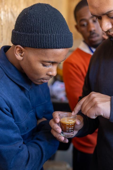 A young man being trained as a barista at Masifunde 