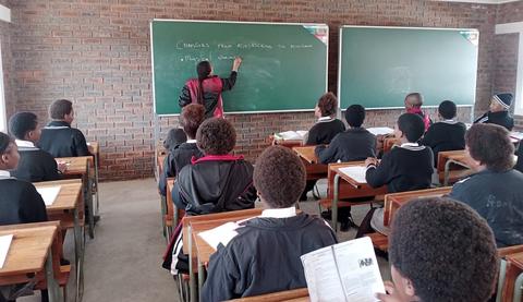 Teaching in one of the six newly constructed classrooms at Ekuphumleni Secondary School in South Africa.