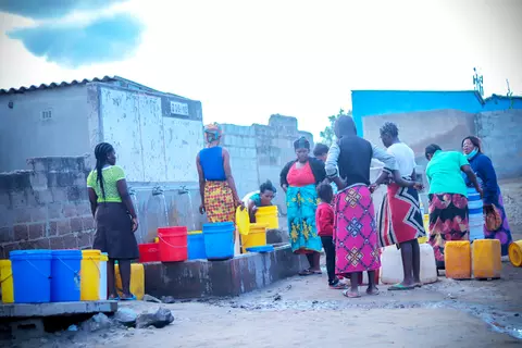Women in Lusaka fetching water from a public well